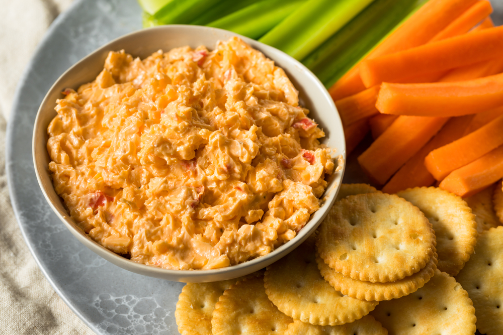 pimento cheese dip with vegetables and crackers