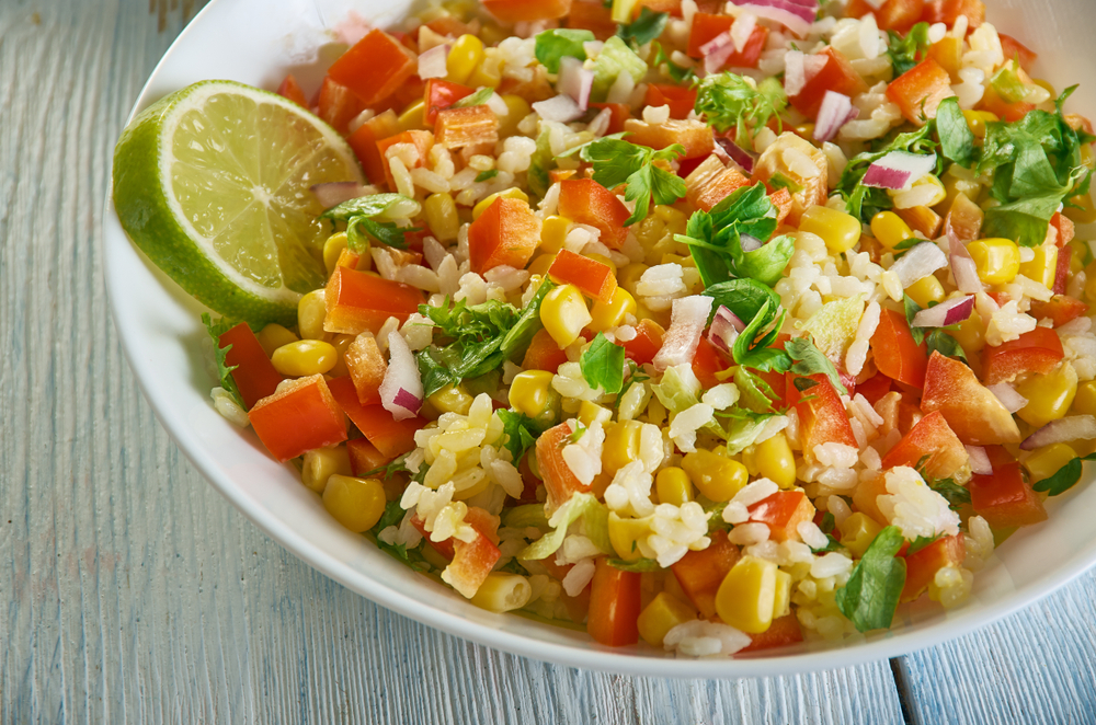 Corn maque choux: Cajun Corn & Pepper Side Dish 4 Corn maque choux with rice, red onion and cilantro for a Mexican twist.